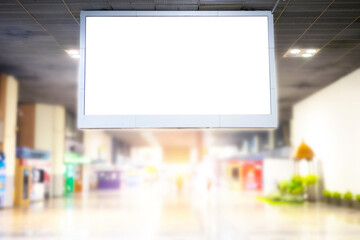 A large billboard mounted on the roof ceiling stands out in the middle