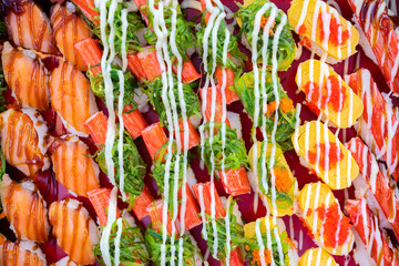 Fototapeta premium Japanese food concept. Catering, various kinds of sushi on plate