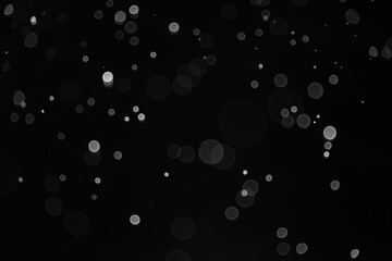Snow Falling from Night Sky. bokeh abstract background
