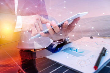 A business man using a tablet computer. Science solar energy, engineer working on checking