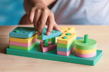 boy playing children toys for learning for skills