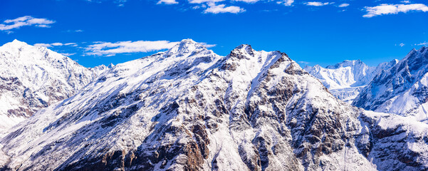 Serene Landscape of snow capped Pir Panjal mountains range during sunrise near Rohtang Pass enroute to Manali from Kaza town in Lahaul and Spiti district of Himachal Pradesh, India.