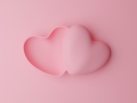 Open pink pastel heart shaped box on pink background. Valentine's day concept
