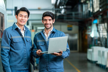 Supervisor manager male engineer worker wears uniform working hand use laptop stock checking in...