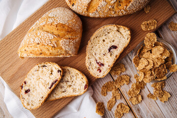 Top view on sliced muesli cereal bread on the wooden cutting board