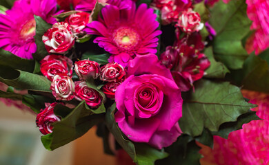 Bouquet of red roses and gerberas flowers closeup