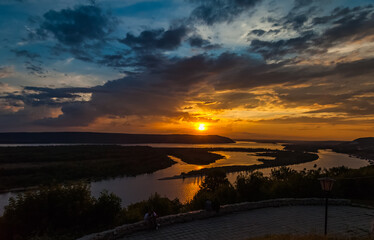 Landscape with sunset on the river in summer