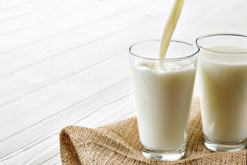 milk pouring into glass