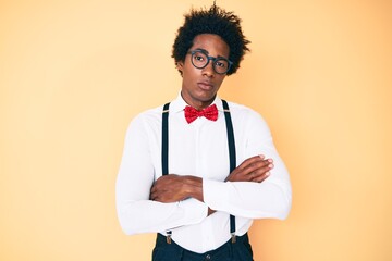 Handsome african american man with afro hair wearing hipster elegant look skeptic and nervous,...