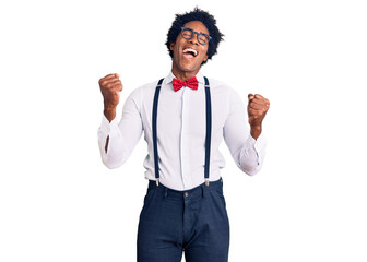 Handsome african american man with afro hair wearing hipster elegant look very happy and excited...