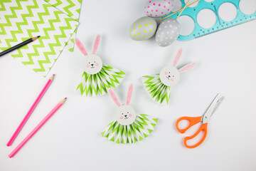 Easter bunny out of paper. DIY step by step. Crafts concept for kids.