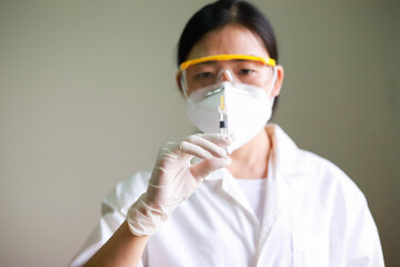A nurse inject vaccine in the hospital.