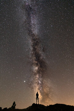 Rear view of unrecognizable person under the milky way