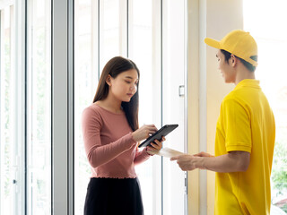 Asian customer girl sign autograph in application for receive confidential document from delivery...