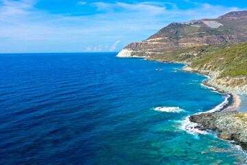 Drone view from the coastal vegetation on the rocky coastline near Erbalunga,  Cap Corse, Corsica, France