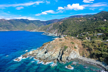 Drone view from the coastal vegetation on the rocky coastline of Cap Corse, Corsica, France