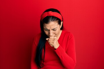 Young latin woman wearing casual clothes feeling unwell and coughing as symptom for cold or bronchitis. health care concept.