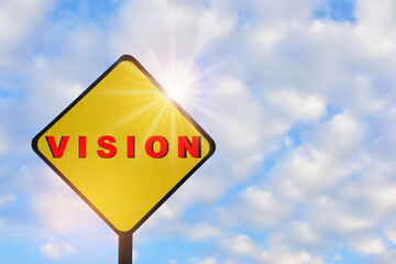 Vision word on yellow sign on beautiful blue sky with fluffy cloud background. Leadership concept and think different idea