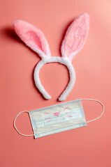 Easter bunny with medical mask on ink background. Easter