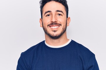 Fototapeta premium Young hispanic man wearing casual clothes with a happy and cool smile on face. lucky person.