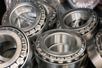 Obraz premium Ball bearings. Industrial steel spare parts close up background. Machinery, engine mechanism, engineering concept.