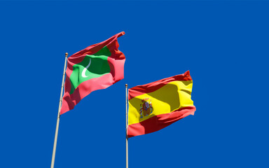 Flags of Maldives and Spain.