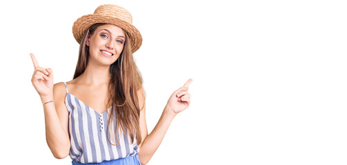 Young beautiful blonde woman wearing summer hat smiling confident pointing with fingers to different directions. copy space for advertisement