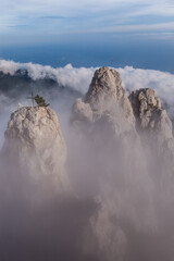 clouds under the three mountain peaks