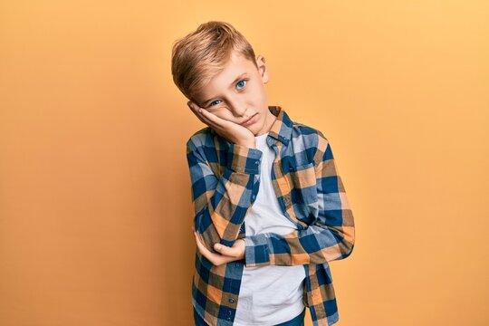 Little caucasian boy kid wearing casual clothes thinking looking tired and bored with depression problems with crossed arms.