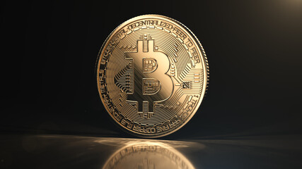 Golden bitcoin coin on black reflective background. Popular digital currency. Cryptocurrency created, distributed, traded, and stored in decentralized ledger system known as a blockchain.
