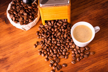 Fresh cafe for morning breakfast refresh caffeine white cup roasted organic coffee bean farm in vintage wood grinder classic metal coffee pot for black espresso and cream milk cappuccino latte
