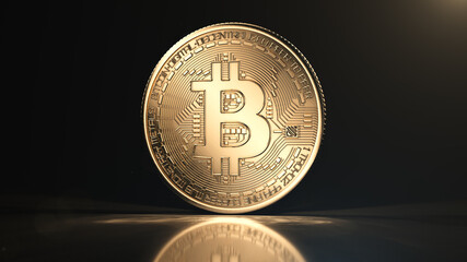 Golden bitcoin coin on black reflective background. Popular digital currency. Cryptocurrency created, distributed, traded, and stored in decentralized ledger system known as a blockchain.