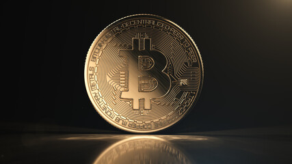 Golden bitcoin coin on black reflective background. Popular digital currency. Cryptocurrency created, distributed, traded, and stored in decentralized ledger system known as a blockchain.