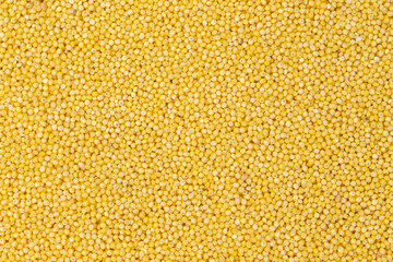 Polished millet texture and details traditional food. Healthy boiled porridge.