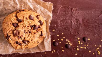 dark chocolate chip cookie round gold concept Organic fresh bake homemade tasty sweet dessert piece of closeup on cookie on wooden table for holiday new year Christmas gift sugar sparkle