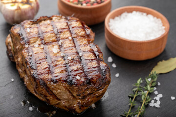 Fresh delicious juicy steak with vegetables and spices