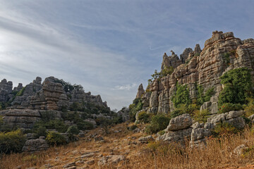 Fototapeta na wymiar Some of the many intricate and varied Limestone rock formations seen in the El Torcal Nature Reserve in Andalucia from a Footpath.