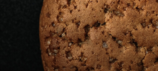 Large oatmeal cookies on a black background