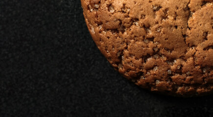 Large oatmeal cookies on a black background