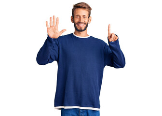 Fototapeta premium Handsome blond man with beard wearing casual sweater showing and pointing up with fingers number six while smiling confident and happy.