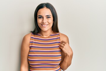 Obraz premium Young brunette woman wearing casual clothes with a happy and cool smile on face. lucky person.