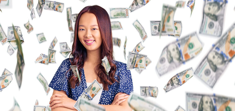 Young beautiful chinese girl wearing casual clothes happy face smiling with crossed arms looking at the camera. positive person.
