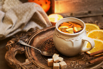 Hot tea with fresh oranges.