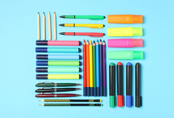Obraz premium Different stationery on light blue background, flat lay. Back to school