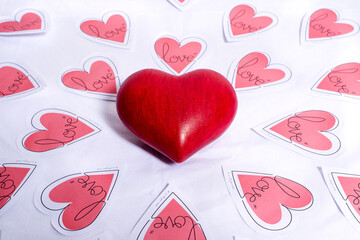 Set of hearts with one red love heart in the middle surrounded by paper hearts. Concept of love, Valentine