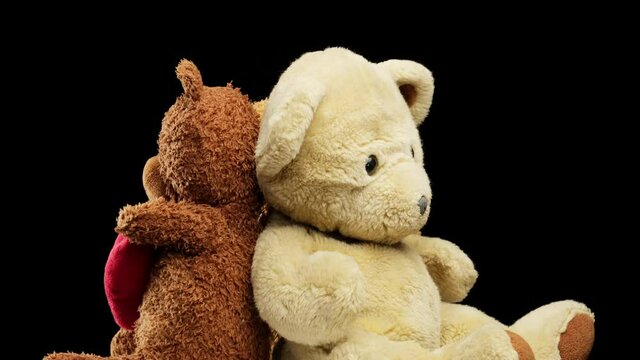 various teddy bears rotates on a black background, children's toy