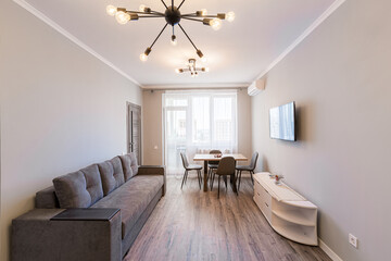Interior photography, modern living room in loft style, with sofa and TV