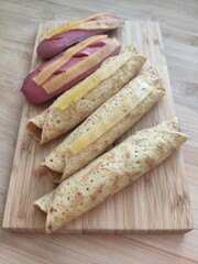 pancakes stuffed with meat and sausages with cheese.