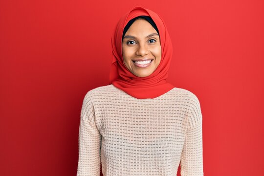 Young African American Woman Wearing Traditional Islamic Hijab Scarf With A Happy And Cool Smile On Face. Lucky Person.