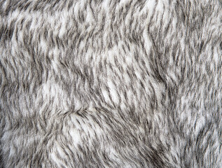 Gray wolf artificial fur background texture for design, black and white fake animal fell